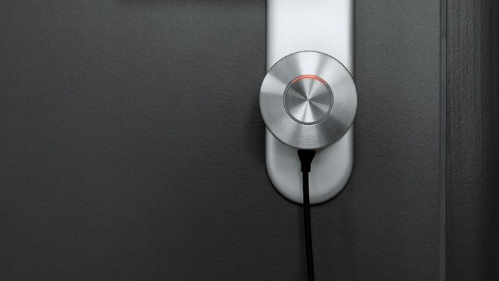 The Nuki charging while installed on a door.