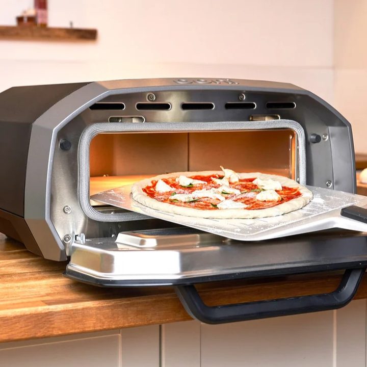 Ooni Volt 12 electric pizza oven used to make food