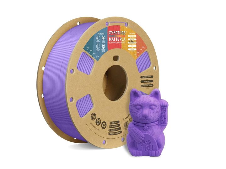 A spool of purple Overture Matte 3D Printer Filament next to an Asian cat figurine.
