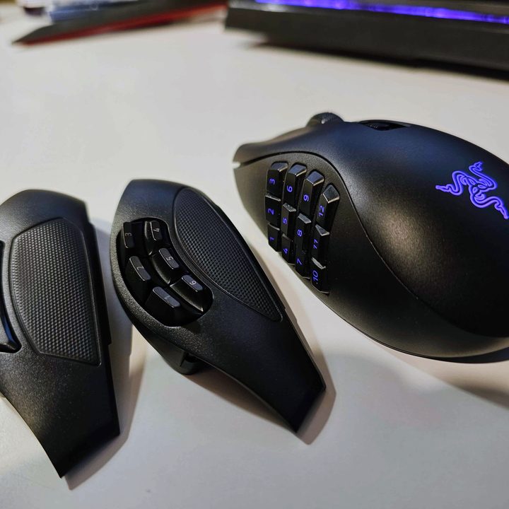 The Razer Naga V2 Pro gaming mouse on a white background, along with two swappable side plates.