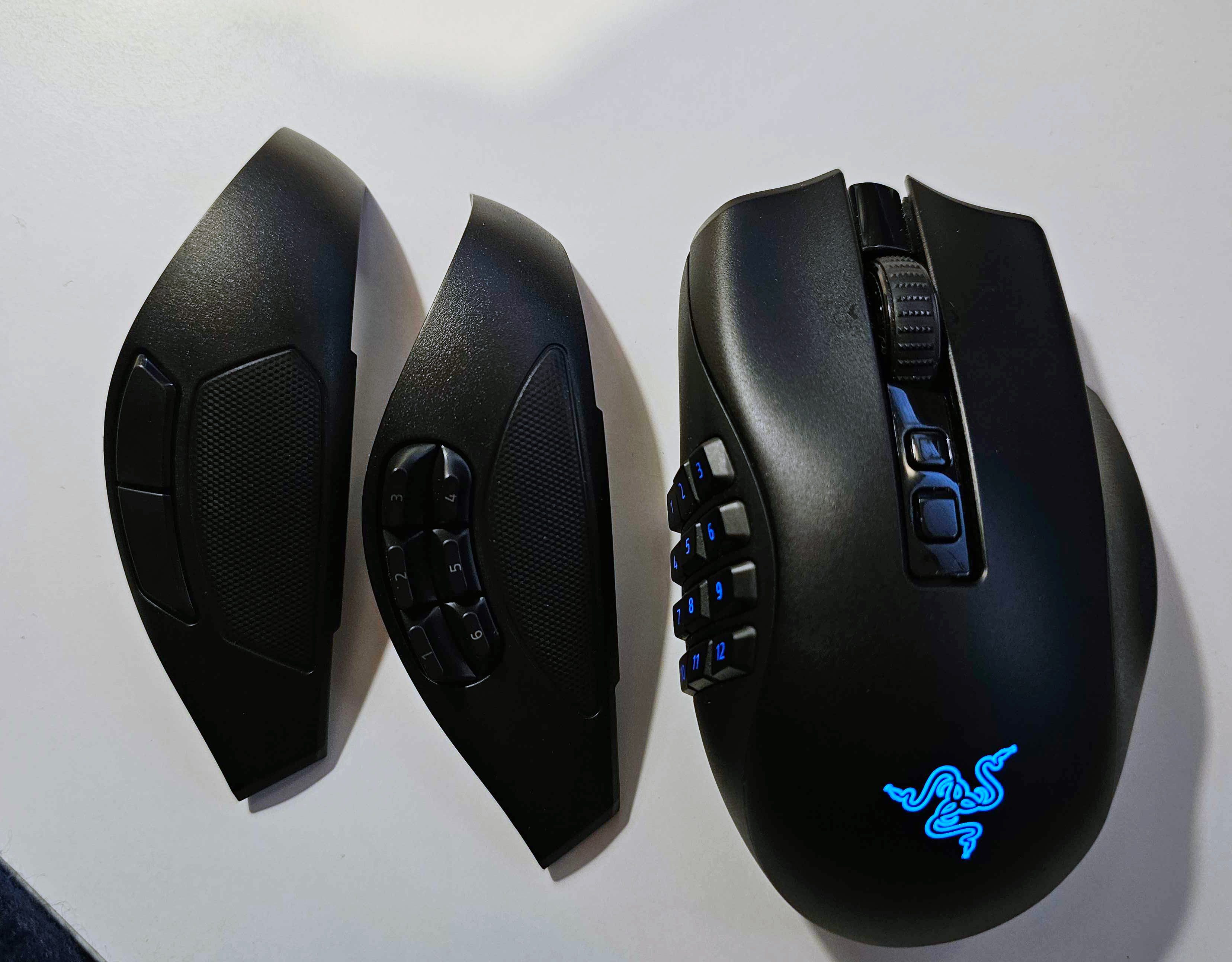 The Razer Naga V2 Pro gaming mouse on a white background, along with two swappable side plates.