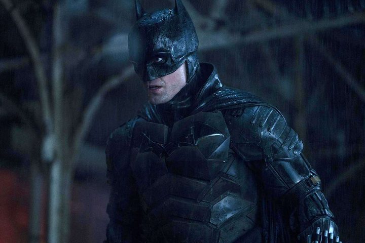 Robert Pattinson wears the Batsuit in the rain in The Batman.