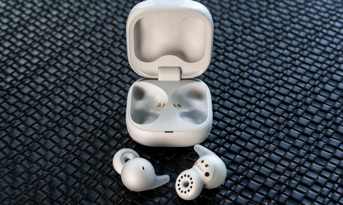 Sony LinkBuds Open loose in front of open case.