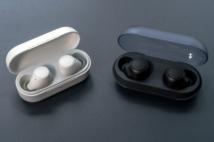 Sony WF-C510 next to WF-C500 with earbuds in each case.