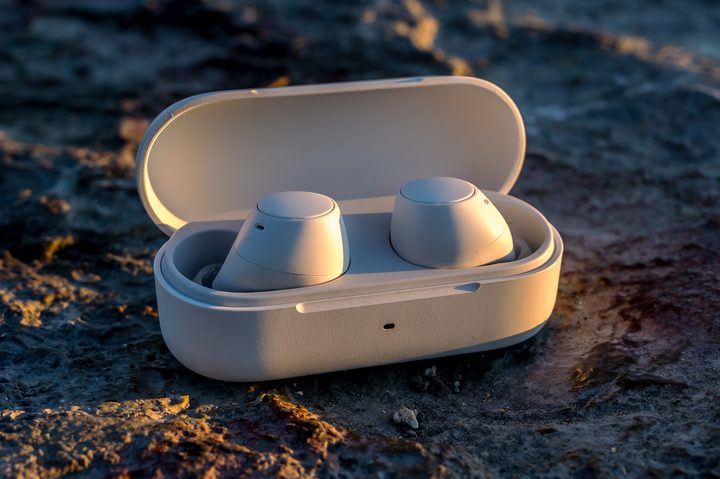 Sony WF-C510 earbuds with open case outside.