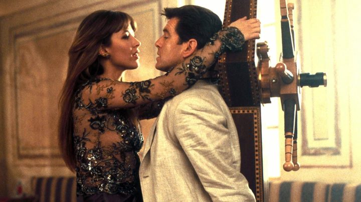 Sophie Marceau as Elektra King holding Pierce Brosnan as James Bond hostage in The World Is Not Enough.