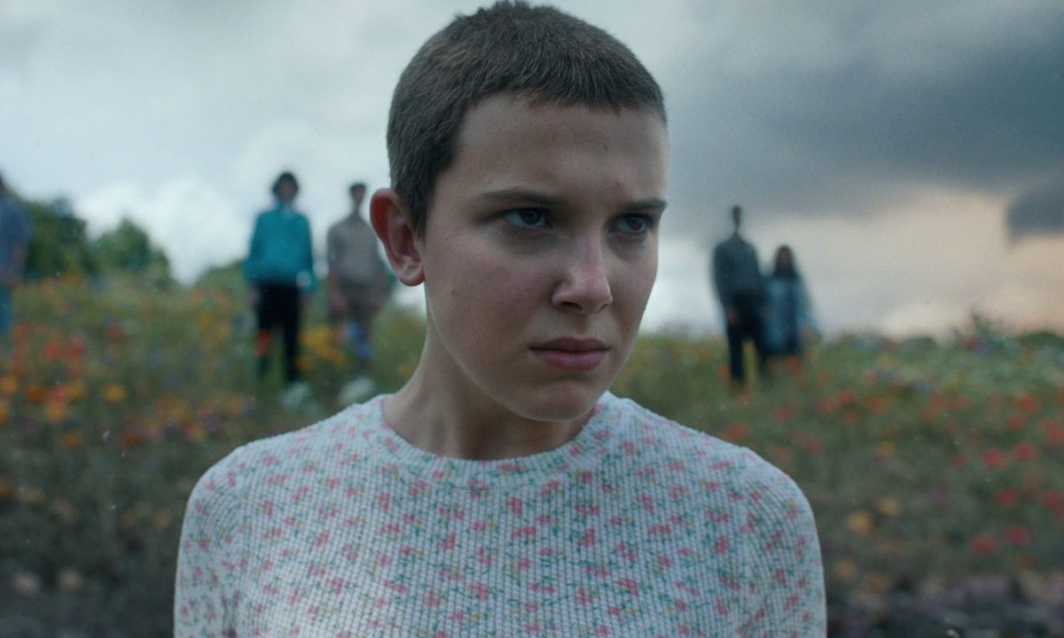 Eleven stands in front of the camera and stares in "Stranger Things."