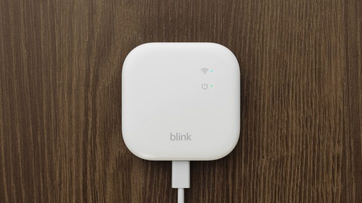 The Blink Sync Module XR on a wooden background.