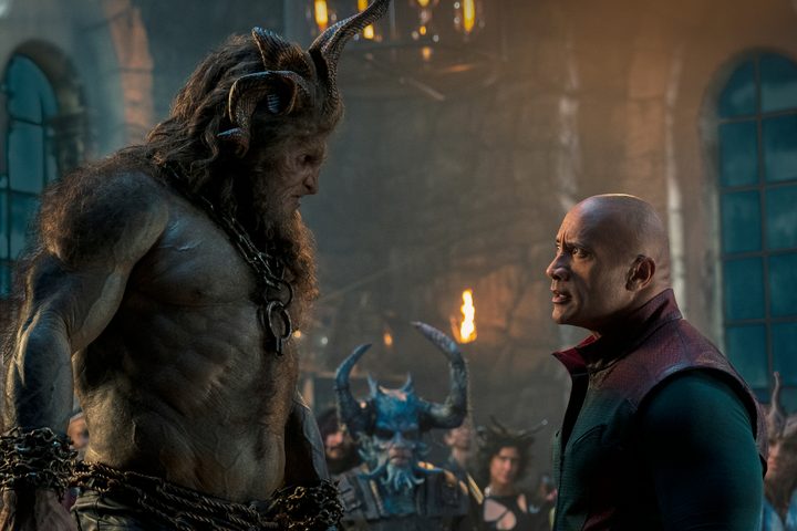 The Rock looks up at Krampus in Red One.