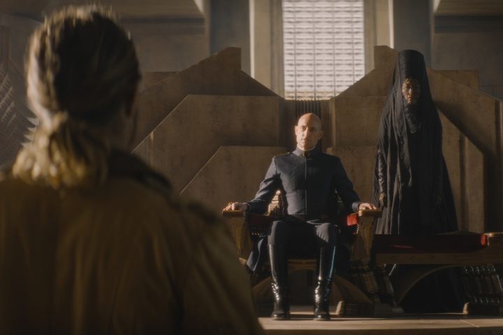 Travis Fimmel stands in front of Mark Strong in Dune: Prophecy.