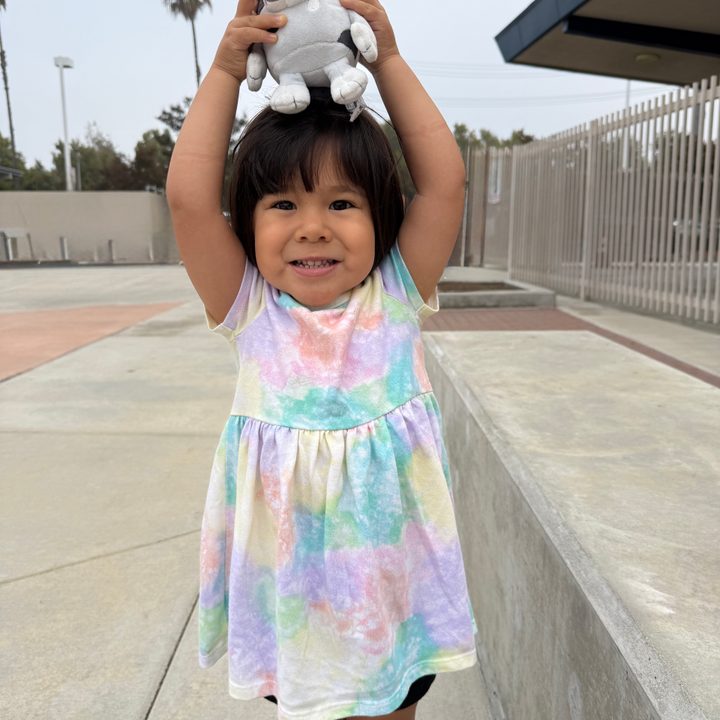 Toddler posing at school.