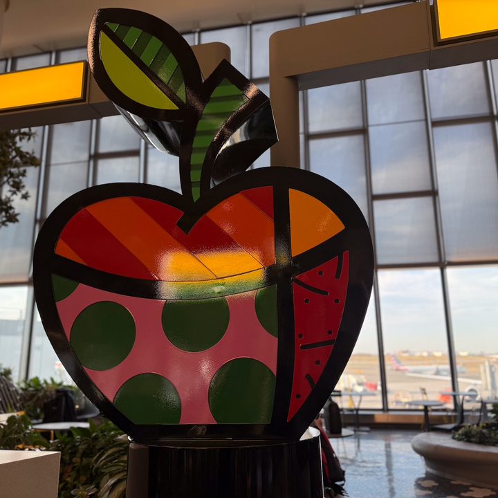 portrait photo of a big apple sign captured on the iPhone 16 Pro.