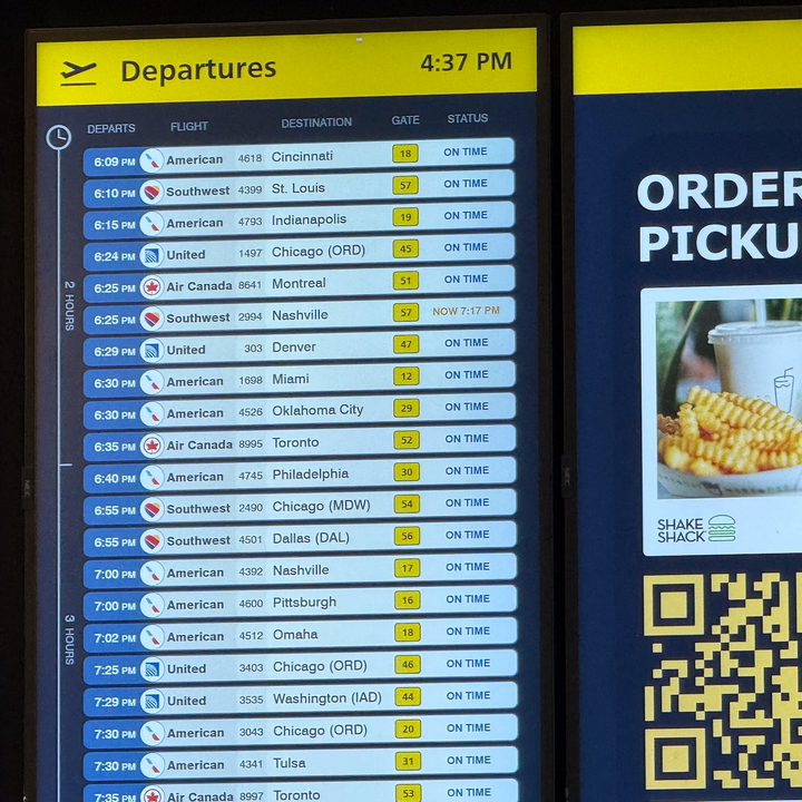 5x photo of an airport information board captured on the iPhone 16 Pro.