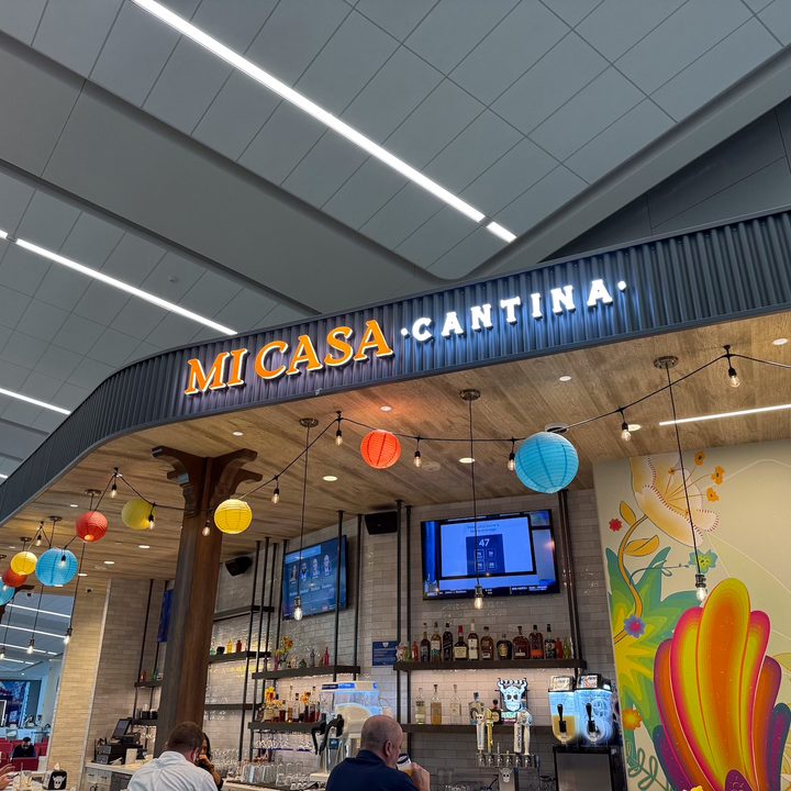 photo of a lit-up Mi Casa Cantina sign captured on the iPhone 16 Pro.