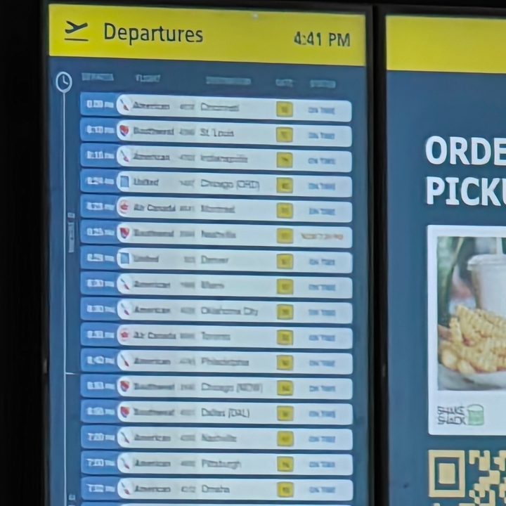 30x photo of an airport information board captured on the OnePlus 12.