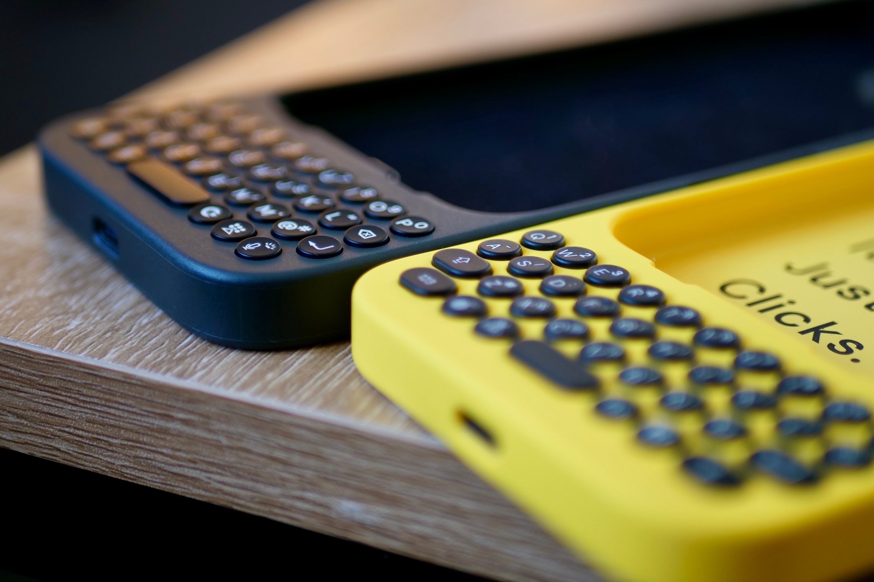 The Clicks Keyboard for iPhone 16 and the original version.