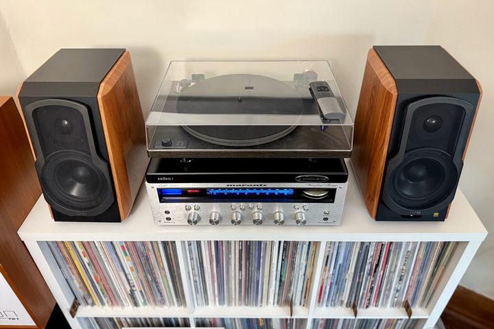 The Edifier S1000W bookshelf speakers on a shelf with a Marantz receiver and a record player.