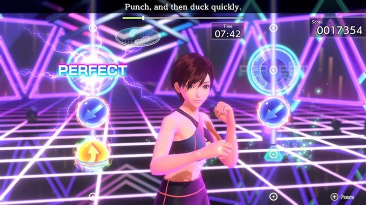 A trainer stands in a punching stance in Fitness Boxing 3: Your Personal Trainer.
