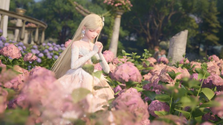 Nikki in blonde hair sitting in a field of flowers in a wedding dress.