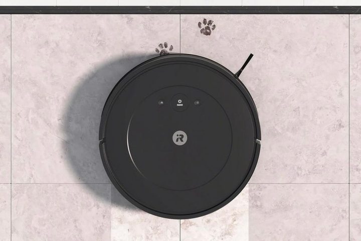 The iRobot Roomba Combo 2 Essential mopping a tile floor.