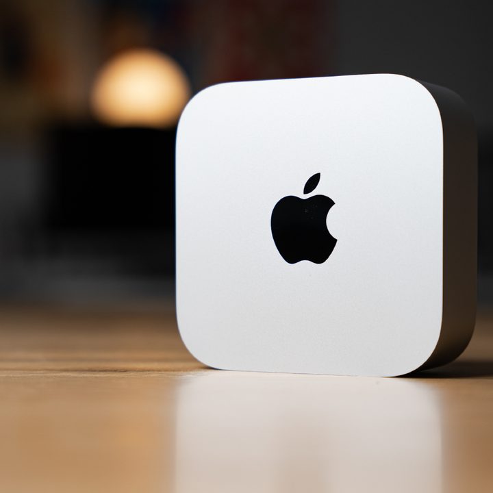 The Mac mini up on its side on a desk.