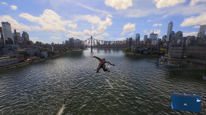 Spider-Man soars over a river in Marvel's Spider-Man 2 on PS5 Pro.