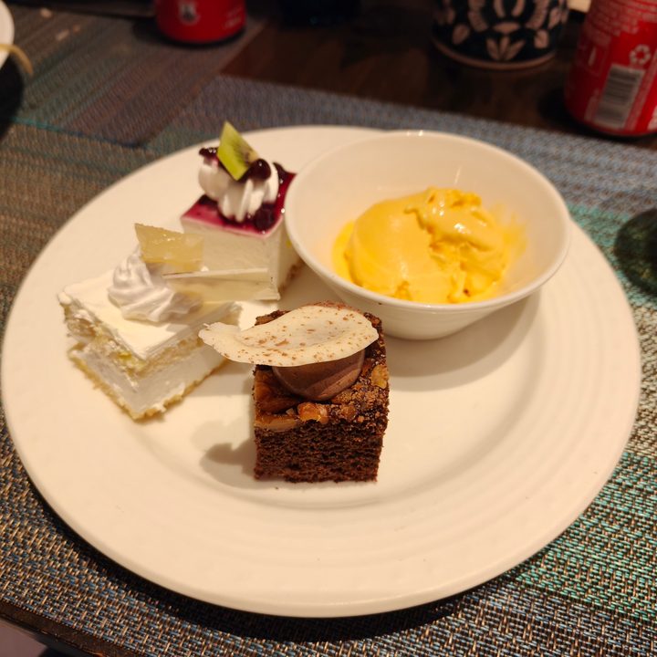 A photo of various desserts on a white plate, taken with the Oppo Find X8.