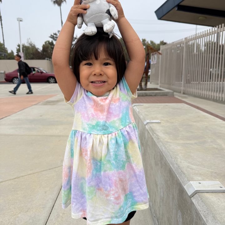 Toddler posing at school.