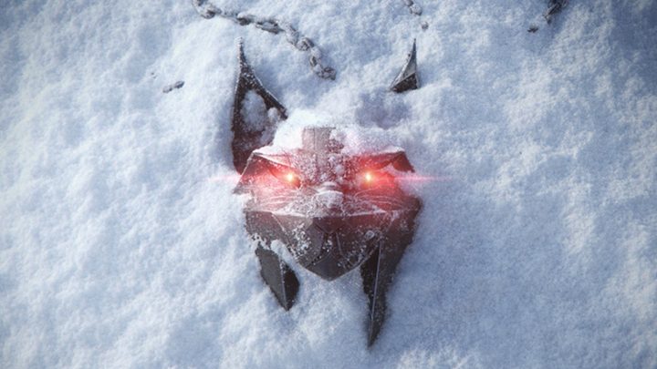 A wolf head with glowing red eyes in the snow.