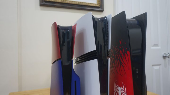 A PS5 slim, PS5 Pro, and base PS5 all stand next to each other.