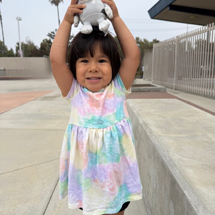 Toddler posing at school.