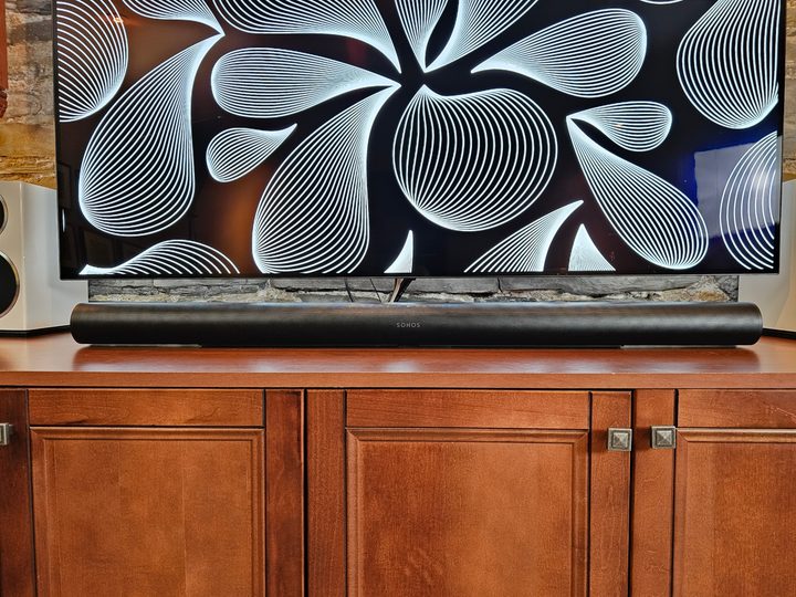 Sonos Arc Ultra in front of a 65-inch TV.