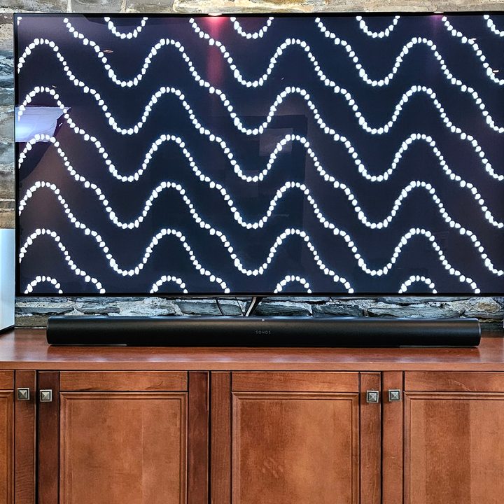 Sonos Arc Ultra in front of a 65-inch TV.