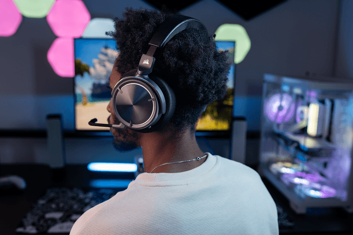 A Virtuoso Max headset sits on a gamer's head.