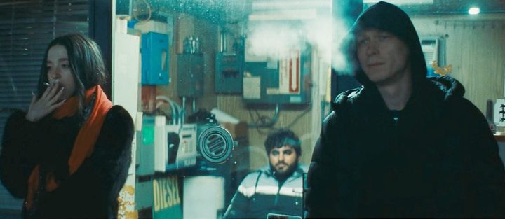 Ani and Boris wait outside in Anora.