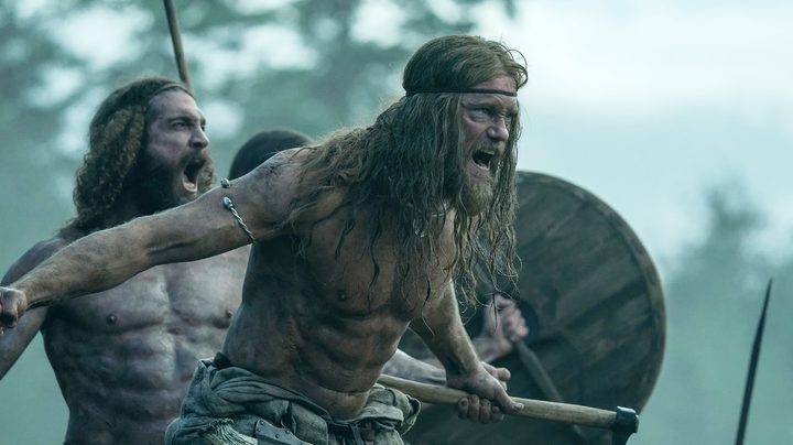 Three warriors battle in The Northman.