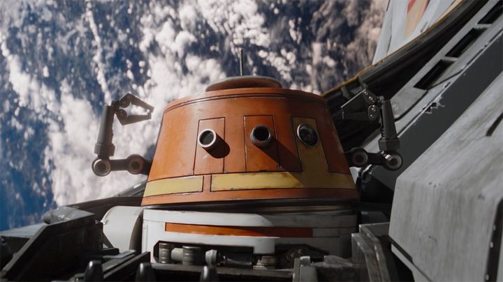 Chopper raises his arms in Ahsoka.