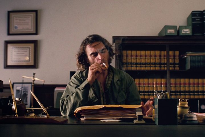Doc smokes in an office in Inherent Vice.