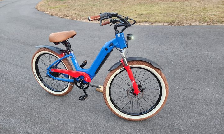 Electric Bike Company Model R parked with headlamp turned on.