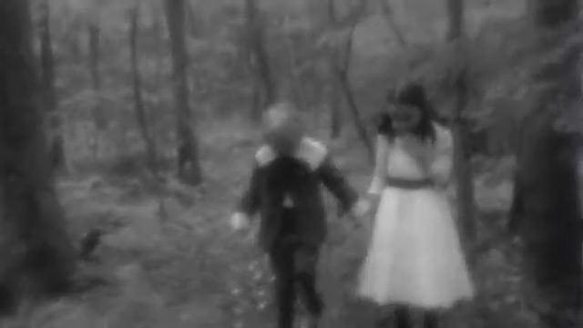 Hansel and Gretel walking through the woods in director Robert Eggers's short film, "Hansel and Gretel."