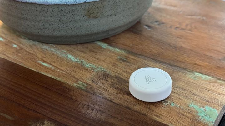 The Flic Smart Button on a table.
