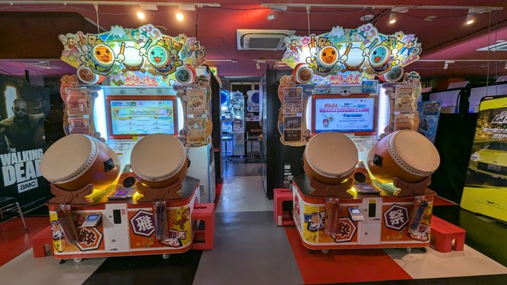 The Taiko no Tatsujin cabinets as a Taito Station arcade.