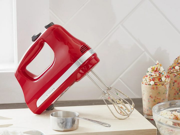 The KitchenAid 3-Speed Hand Mixer on the kitchen counter.