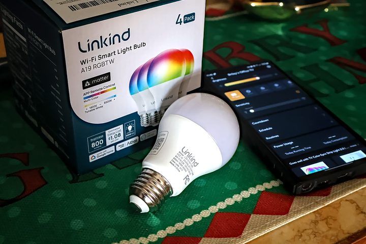 Linkind A19 E26 color smart bulbs on counter with app in view -- Briley Kenney Digital Trends