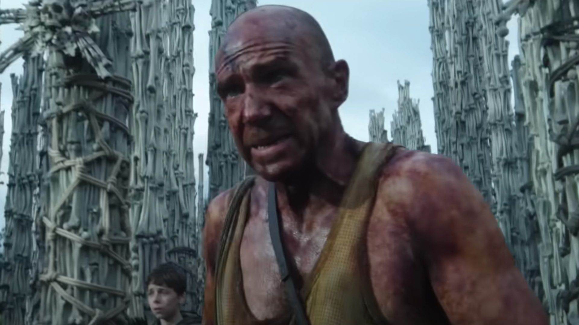 A bloody Ralph Fiennes walks toward the camera in "28 Years Later."