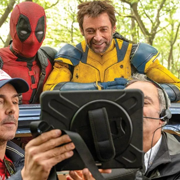 Deadpool and Wolverine look at a monitor from a car on the set of "Deadpool & Wolverine."