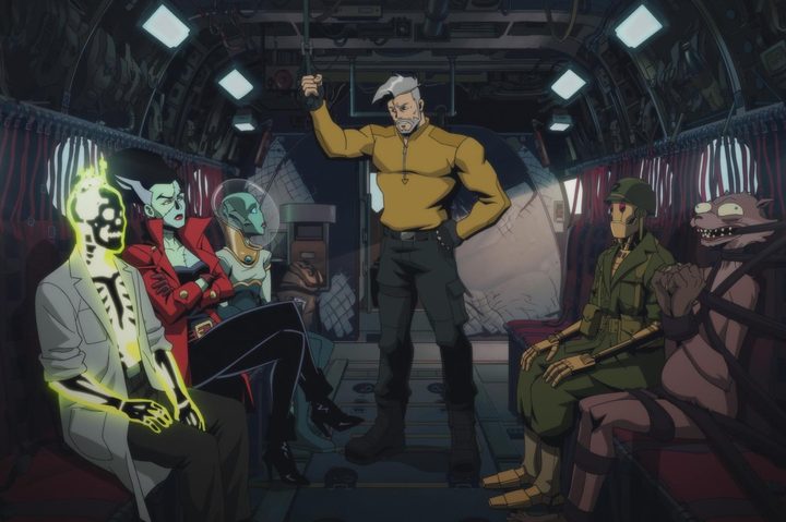 The Creature Commandos sit and stand in the back of a cargo plane together.