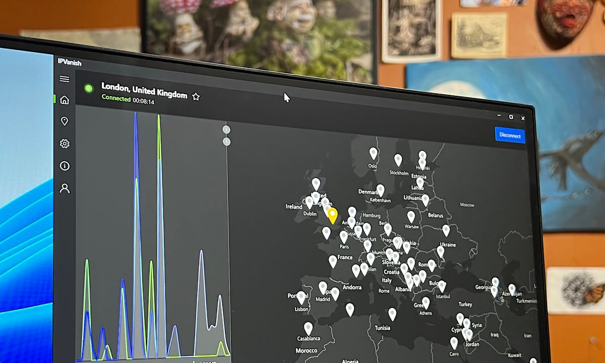 The IPVanish Windows app is open on a PC monitor.