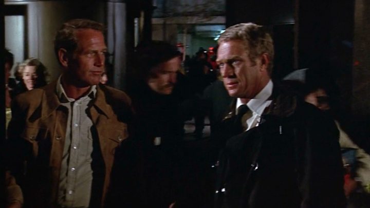 Paul Newman and Steve McQueen face each other in The Towering Inferno.