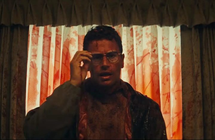 A bloody man touches his glasses in The Monkey.